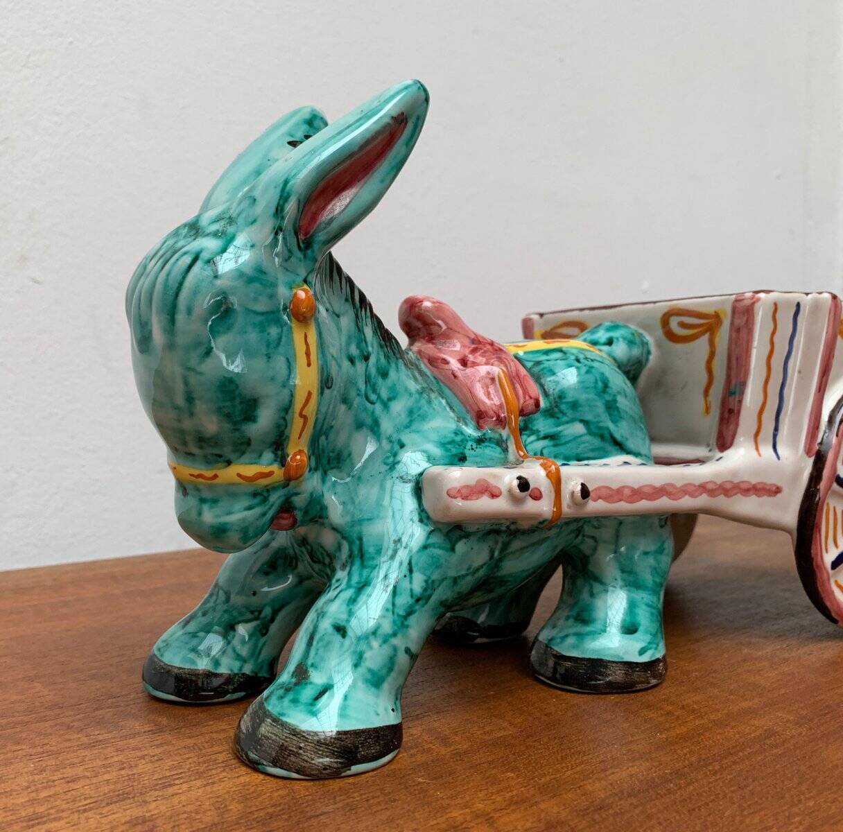 Vintage Italian hand-painted sculpture of a donkey with a cart in the shape of a bowl from Deruta, Italy.