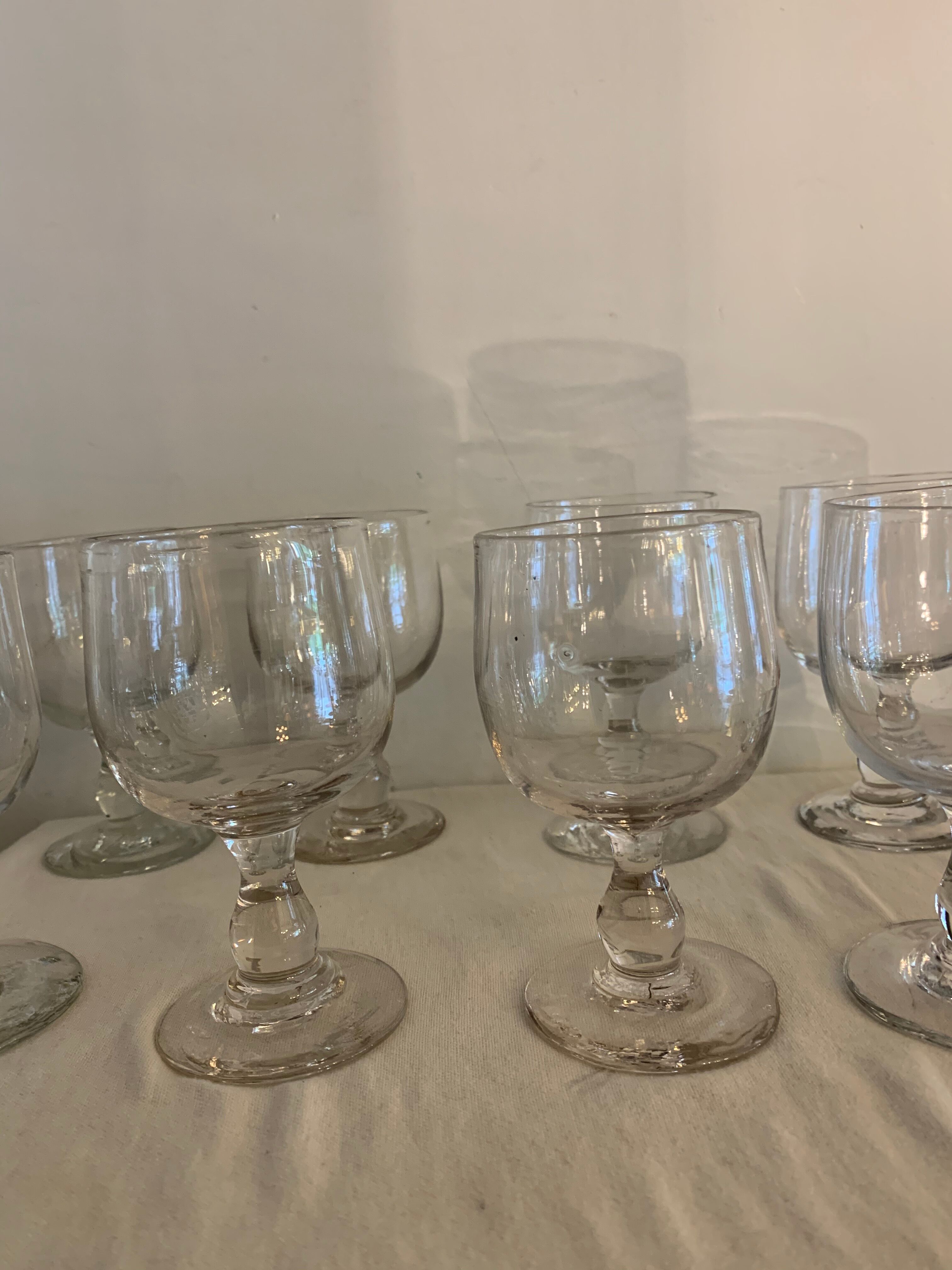 8 old red wine glasses with blown and bubbled glass walk
