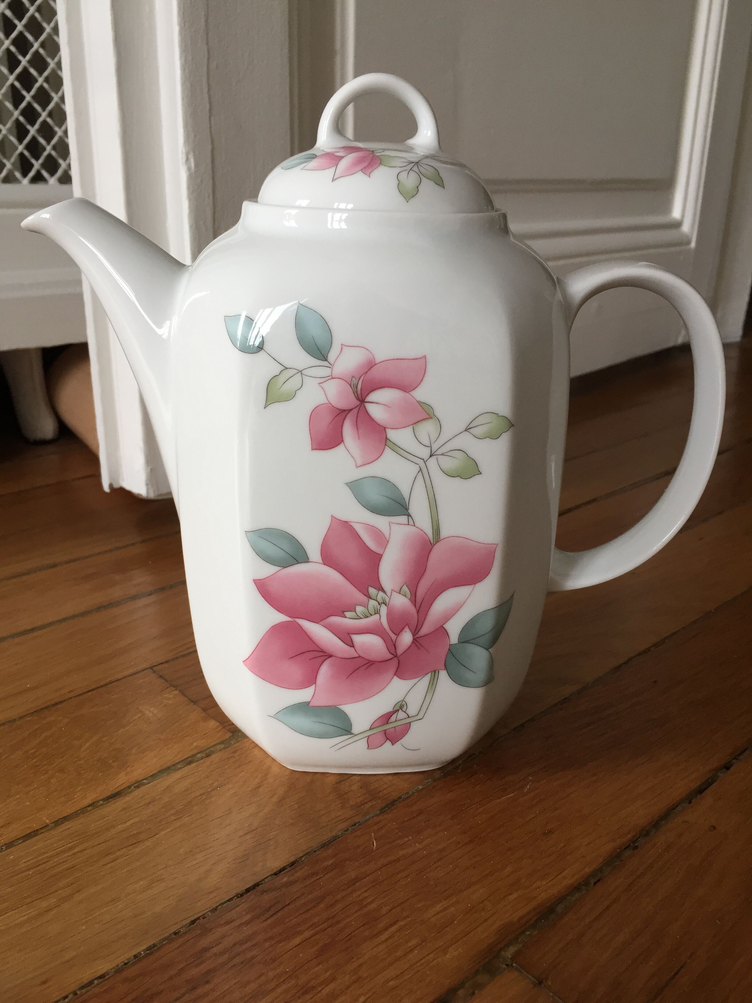 Vintage porcelain coffee or teapot with milk jug
