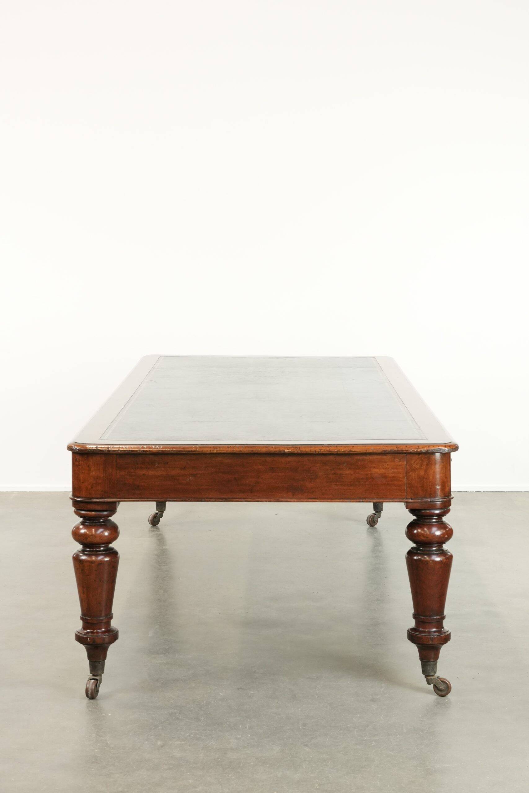 Antique English library table / writing table / desk from the 19th century