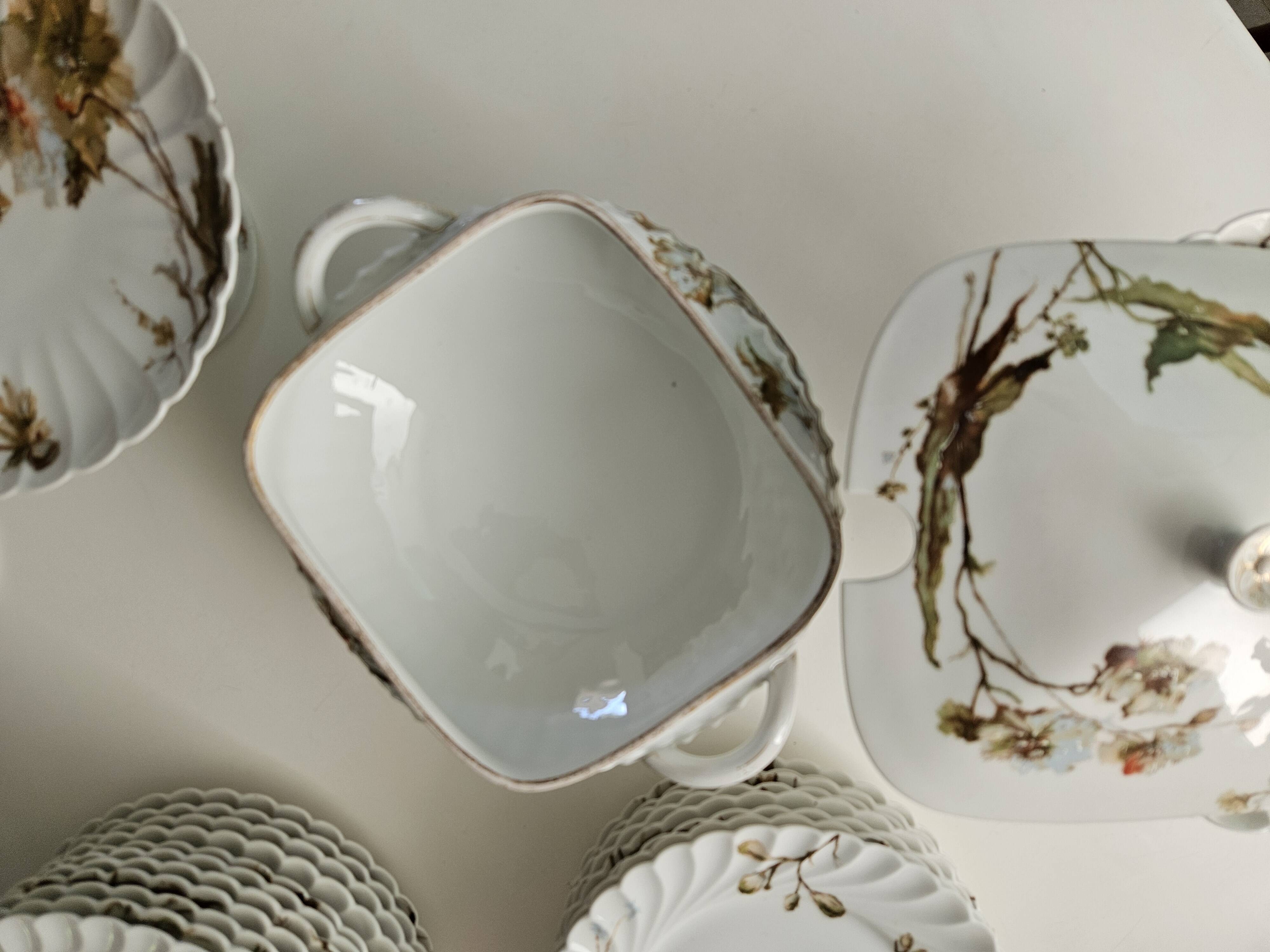 Haviland service plates, dishes on pedestals and soup tureen