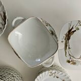 Haviland service plates, dishes on pedestals and soup tureen