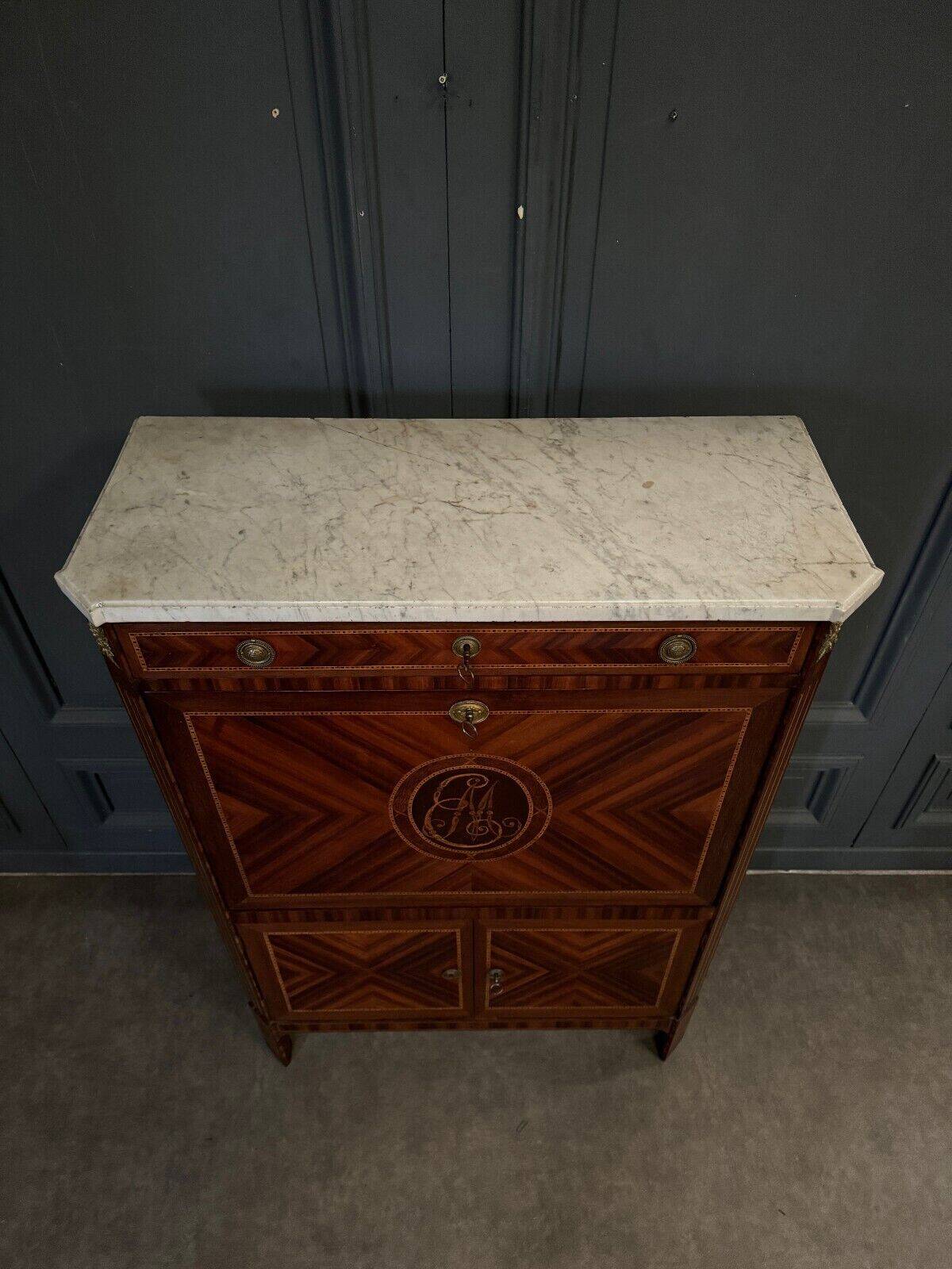 Louis XVI period secretary in monogram marquetry and white marble