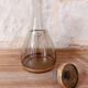 Vintage liqueur service, carafe and 7 amber brown glasses with gold edging