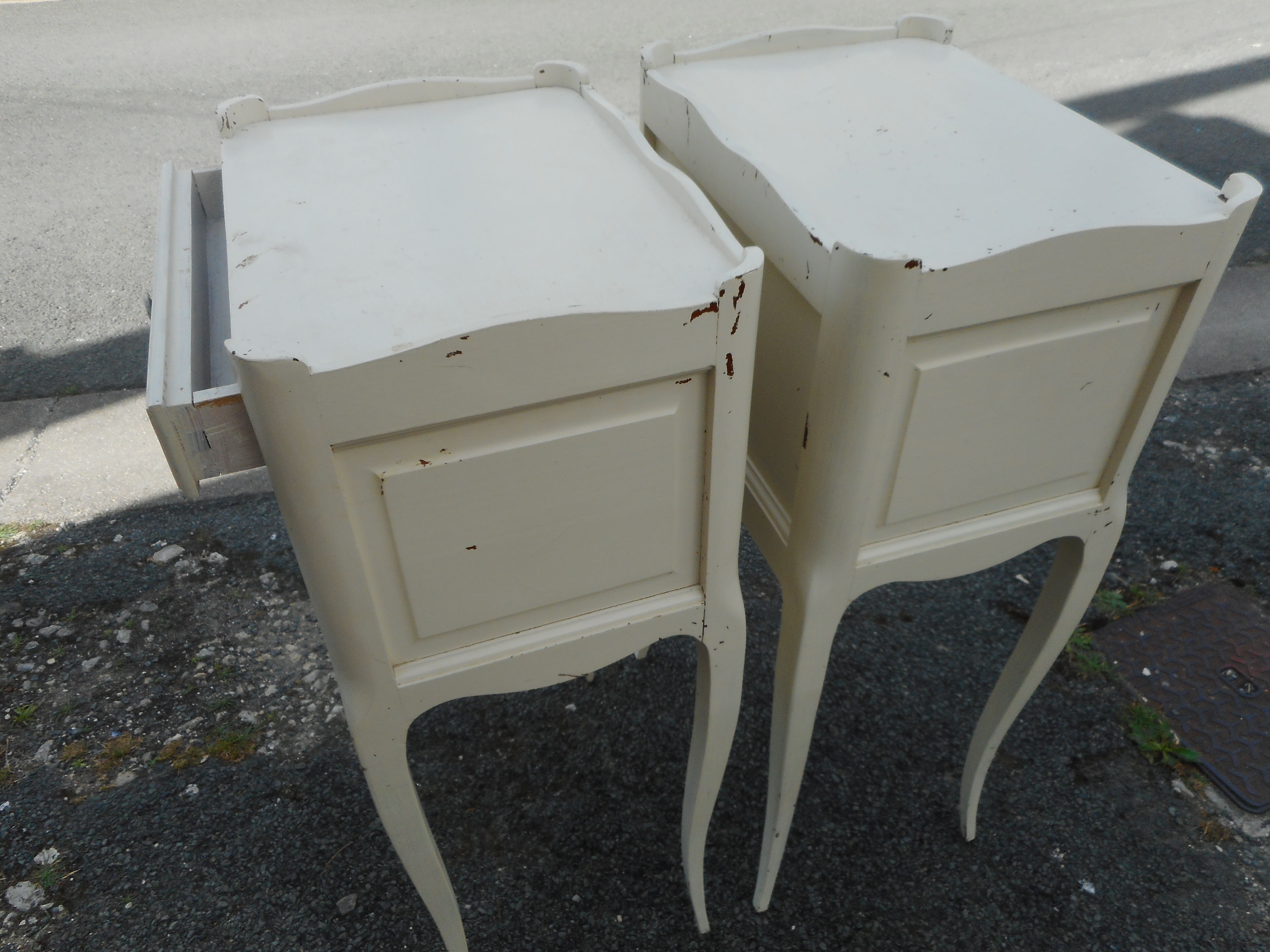 Pair of white lacquered bedside tables