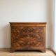 Antique walnut chest of drawers with three drawers.