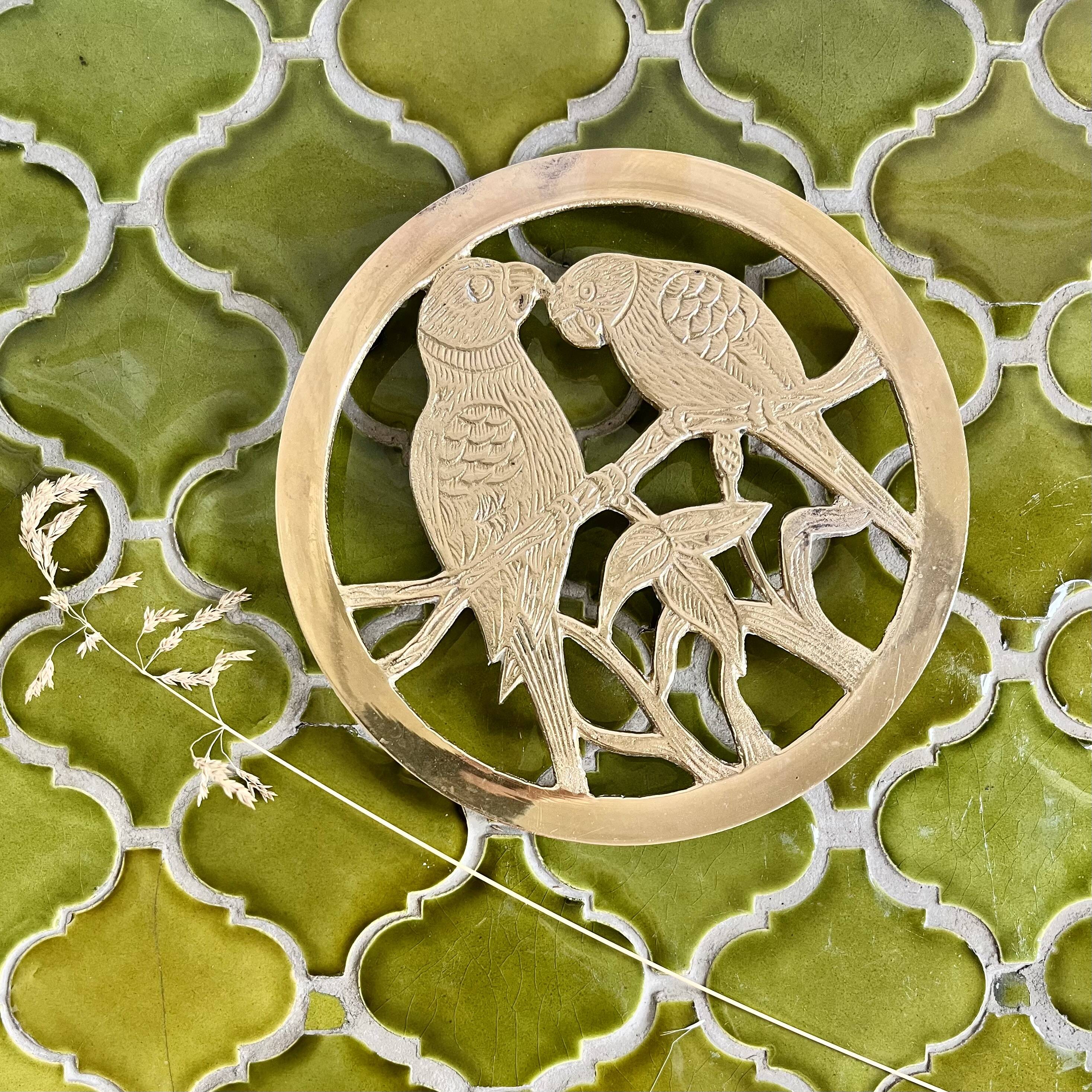 Small brass trivet with parrots or inseparable birds
