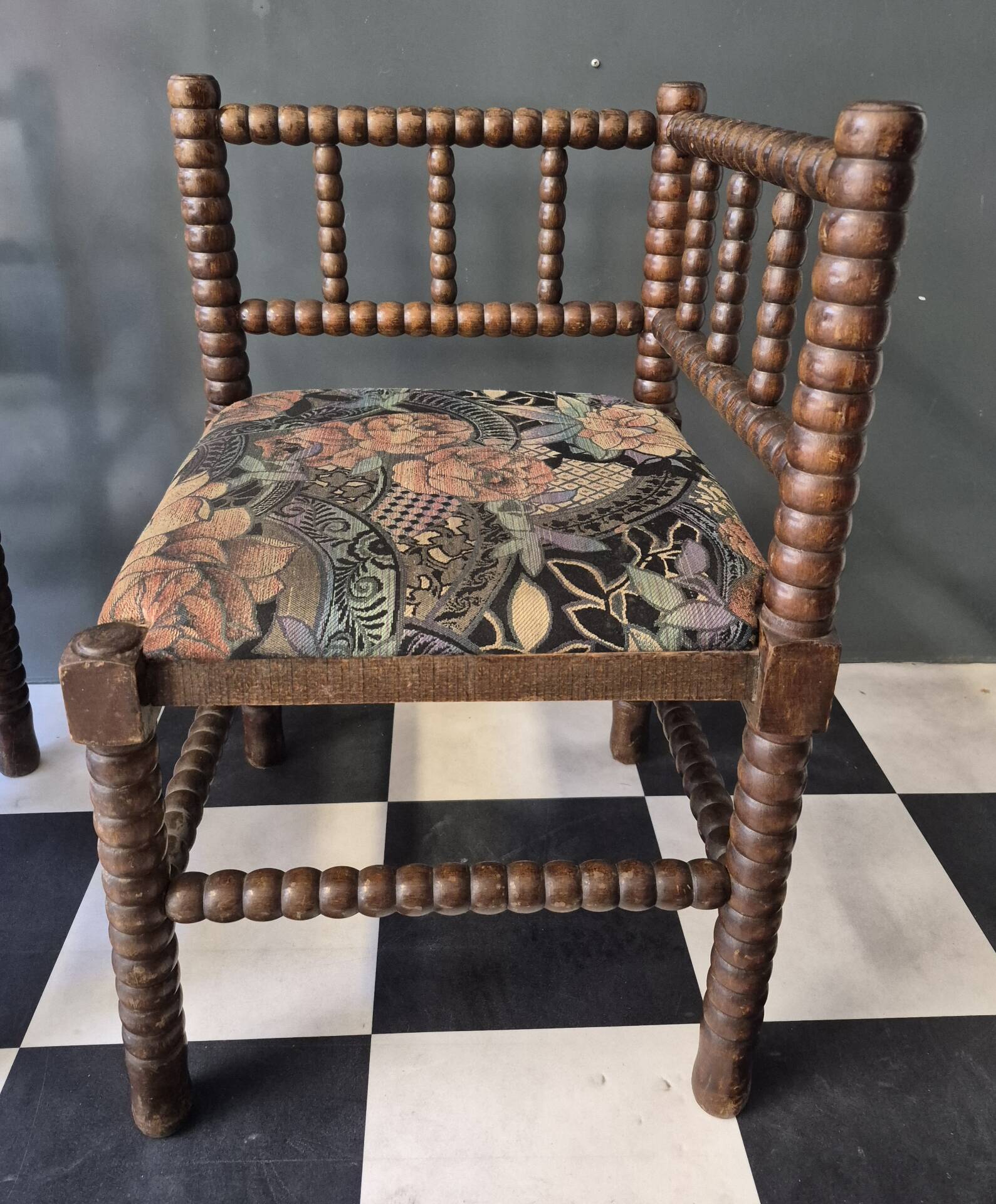 Old pair of corner chairs known as 'fireplace corner' armchairs.