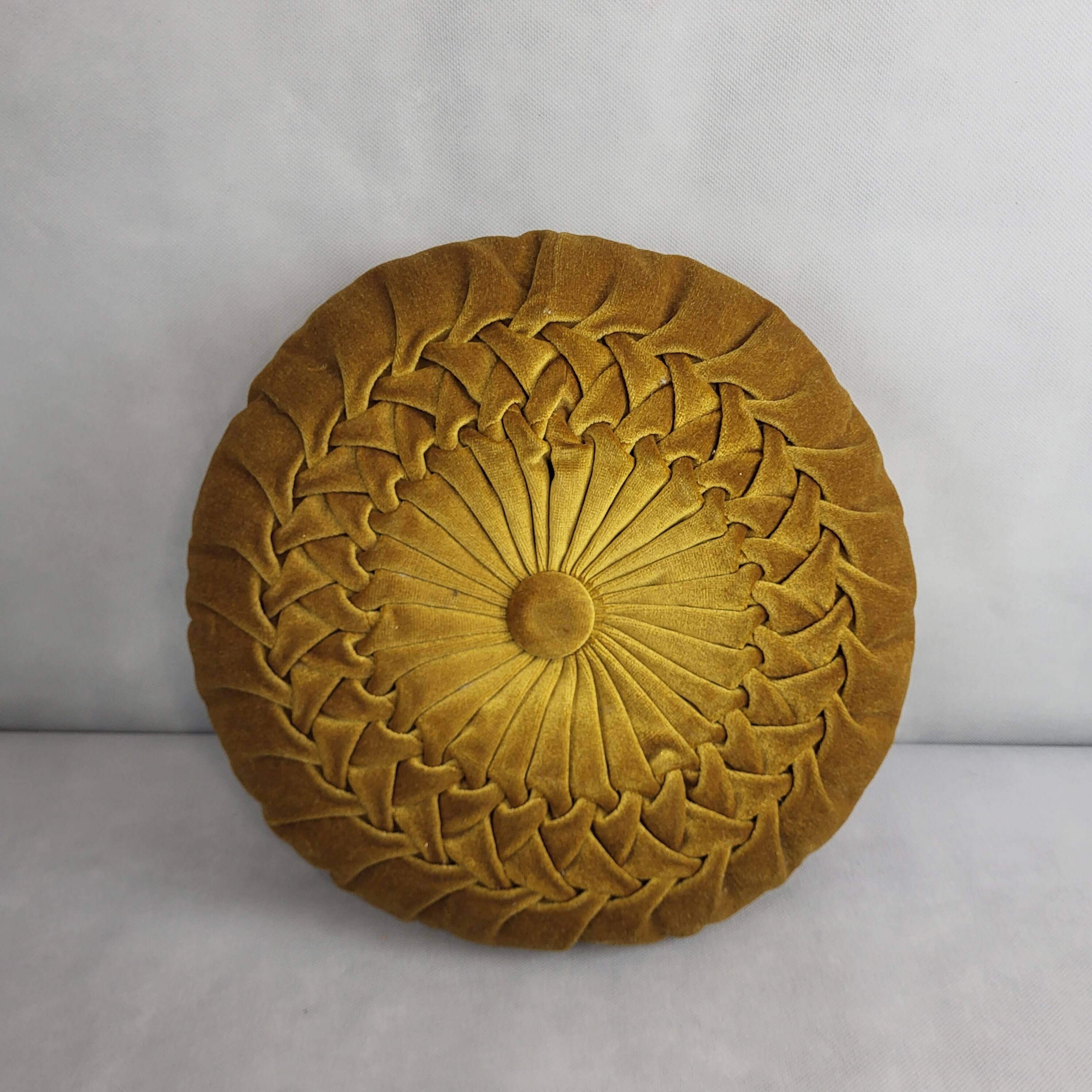 Round pleated velvet cushion