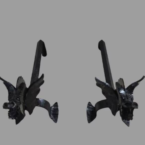 A pair of wrought iron andirons with dragon heads, 1970s.