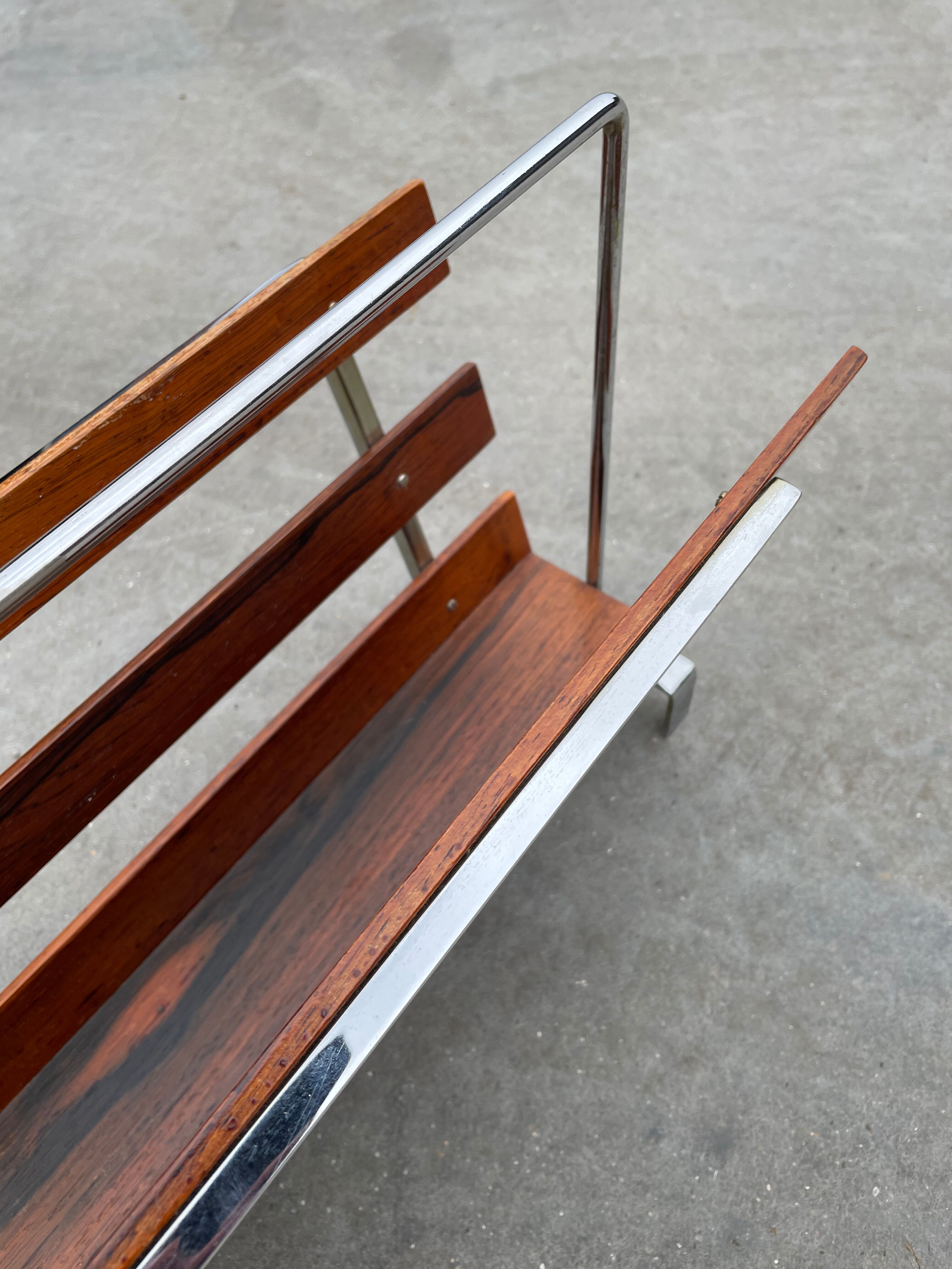 Vintage magazine rack from  rosewood and chrome design