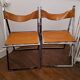 2 Chromed metal and leather folding chairs. 70s. Fontoni & Geraci