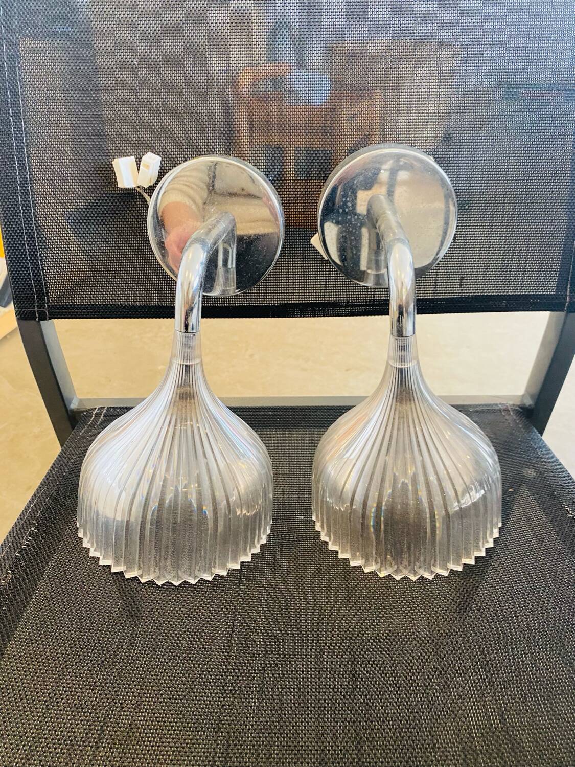 Many Kartell wall lamps.