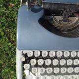 Typewriter blue japy script  with manual and carrying case