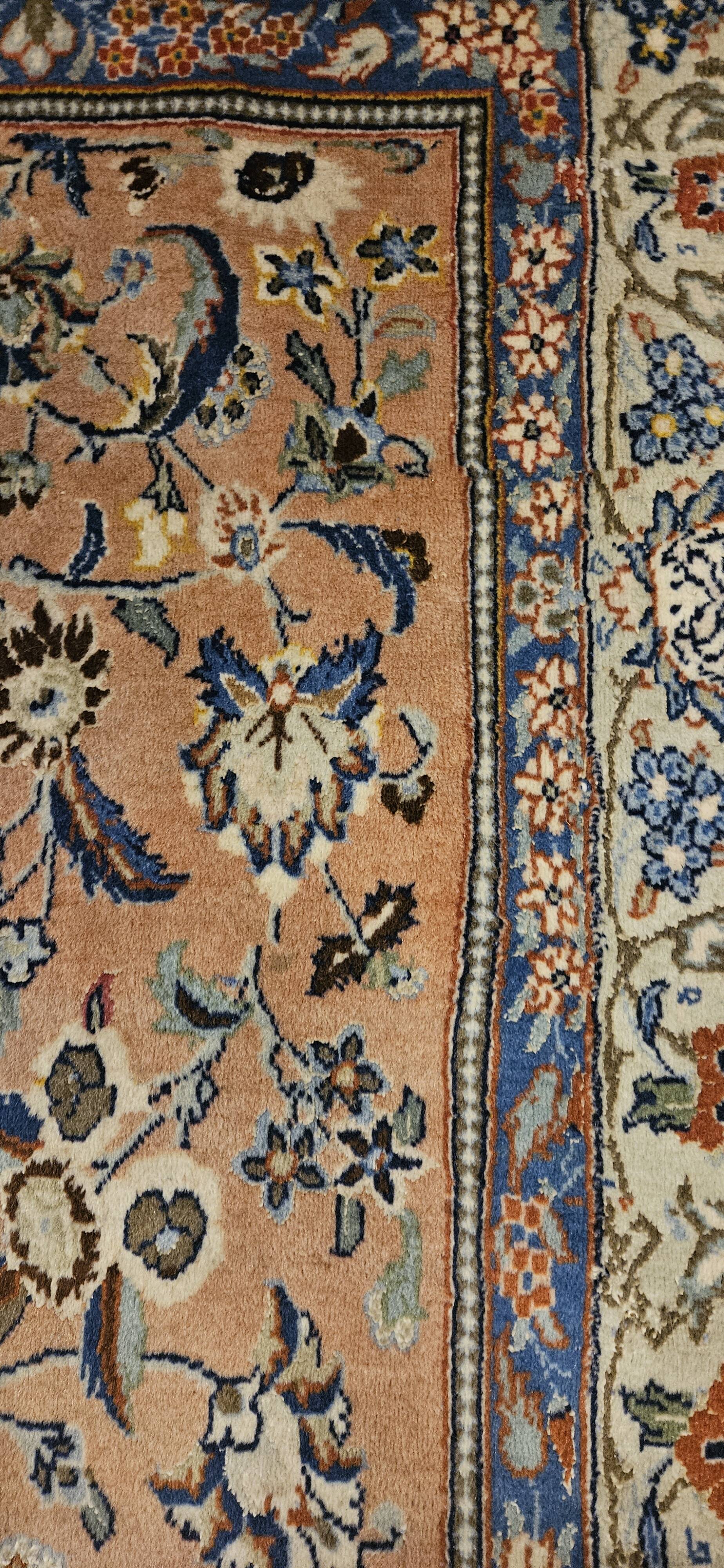 Large wool and silk oriental carpet.