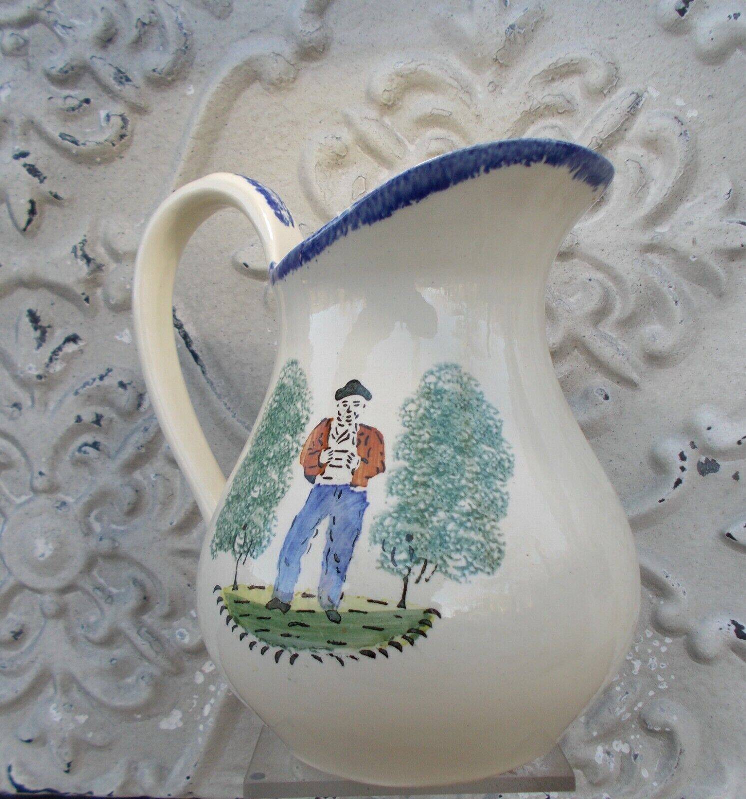 1 St Clément earthenware pouring jug decorated with characters