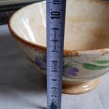 Old bowl in earthenware with floral decoration.