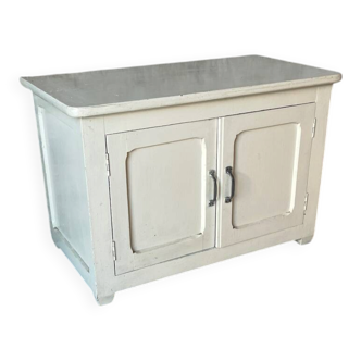 Antique white patinated low cabinet