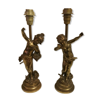 Pair of signed cherub lamp