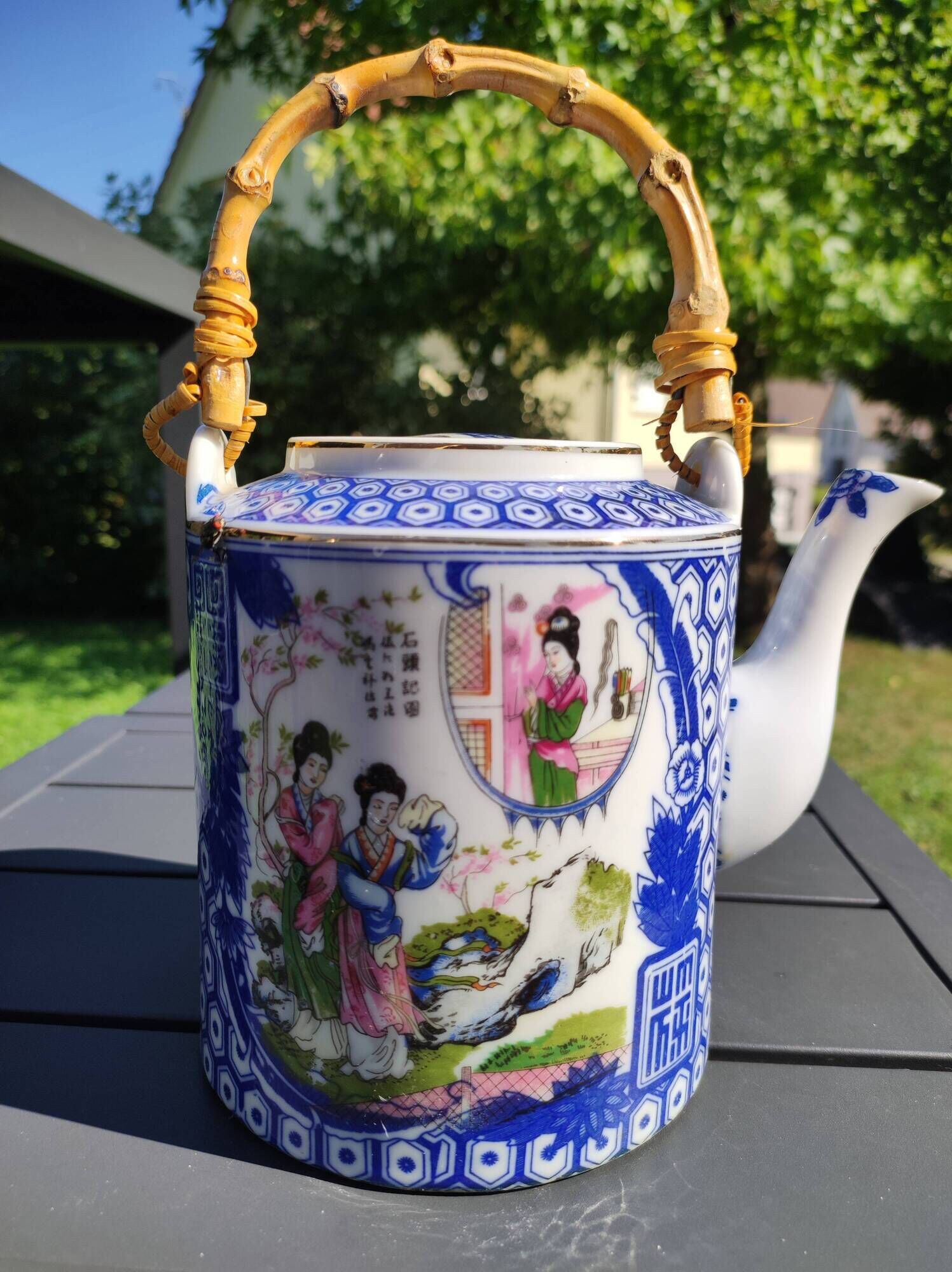 Asian, Japanese fine porcelain teapot with woven bamboo handle, vintage 50s
