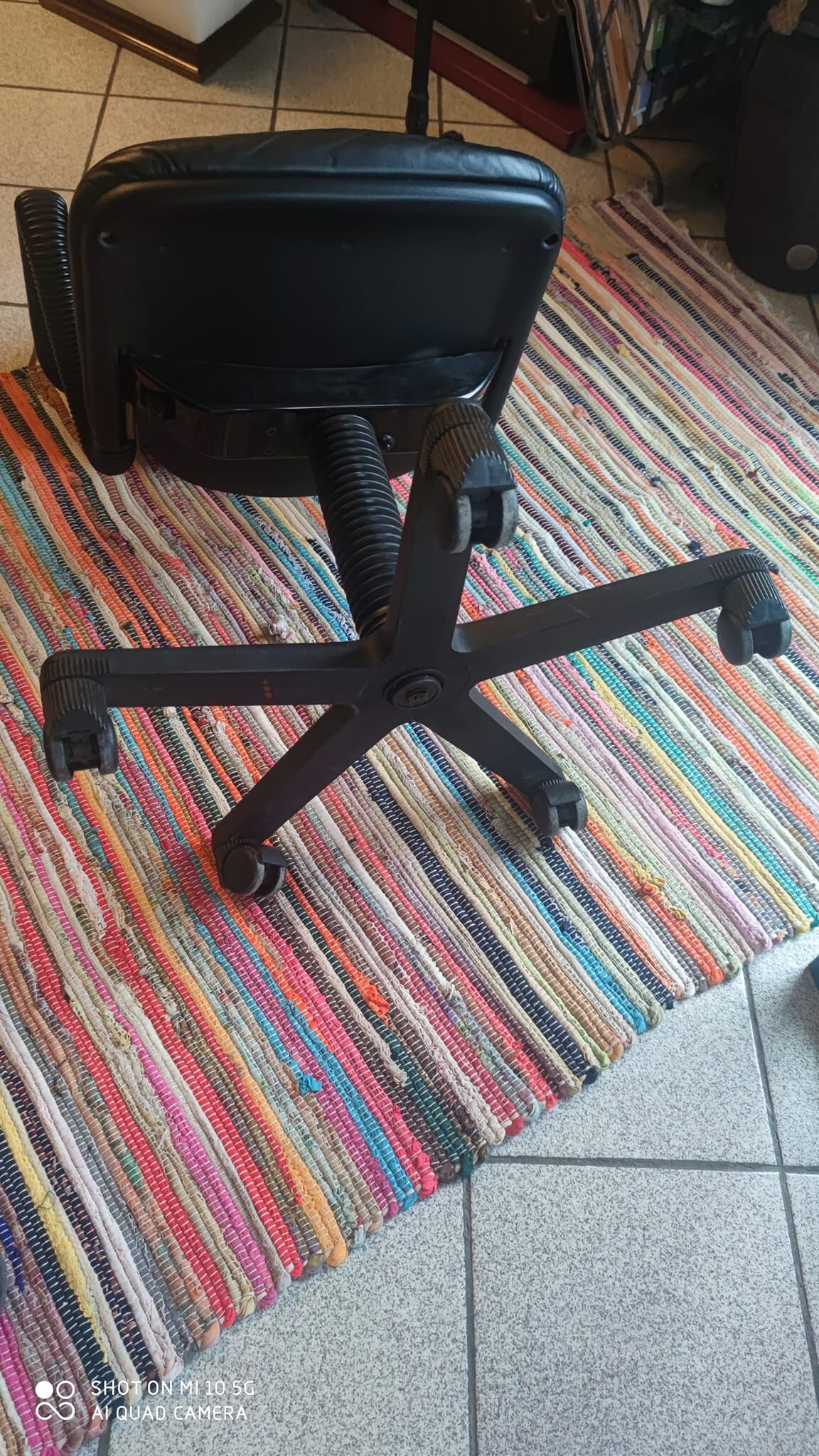 Two black leather armchairs