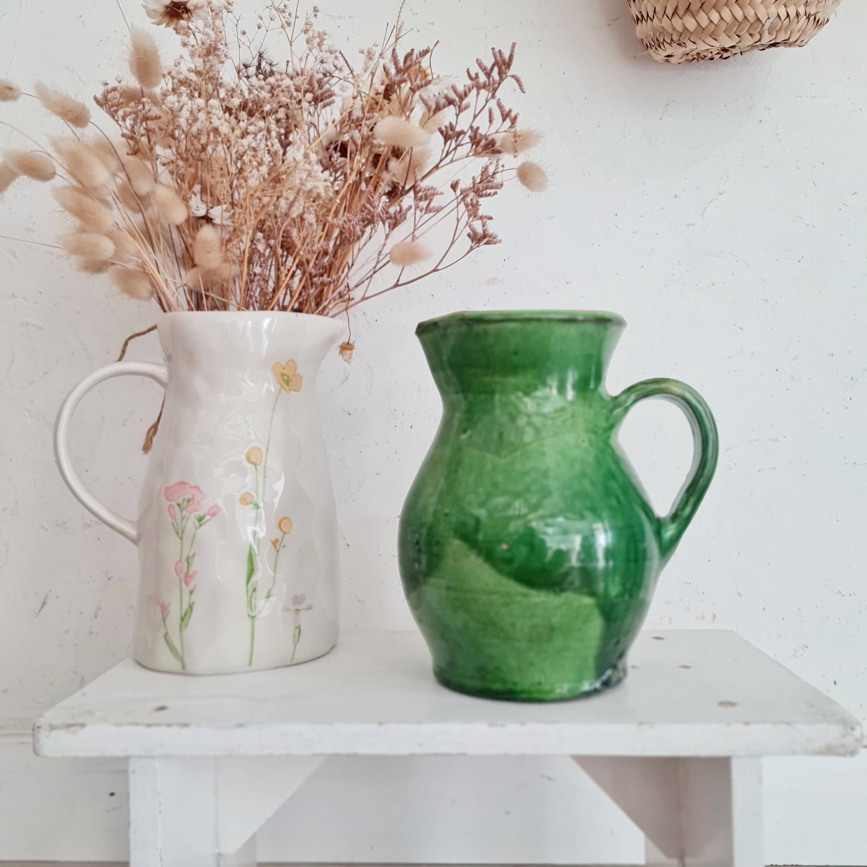 Antique green pitcher in painted terracotta