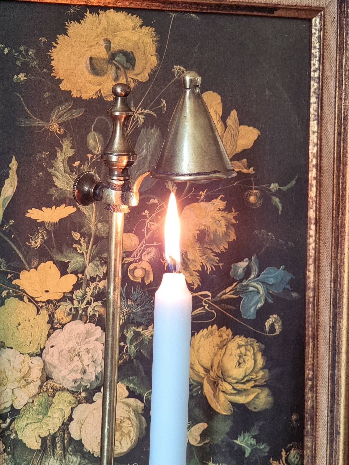 Candle holder with snuffer