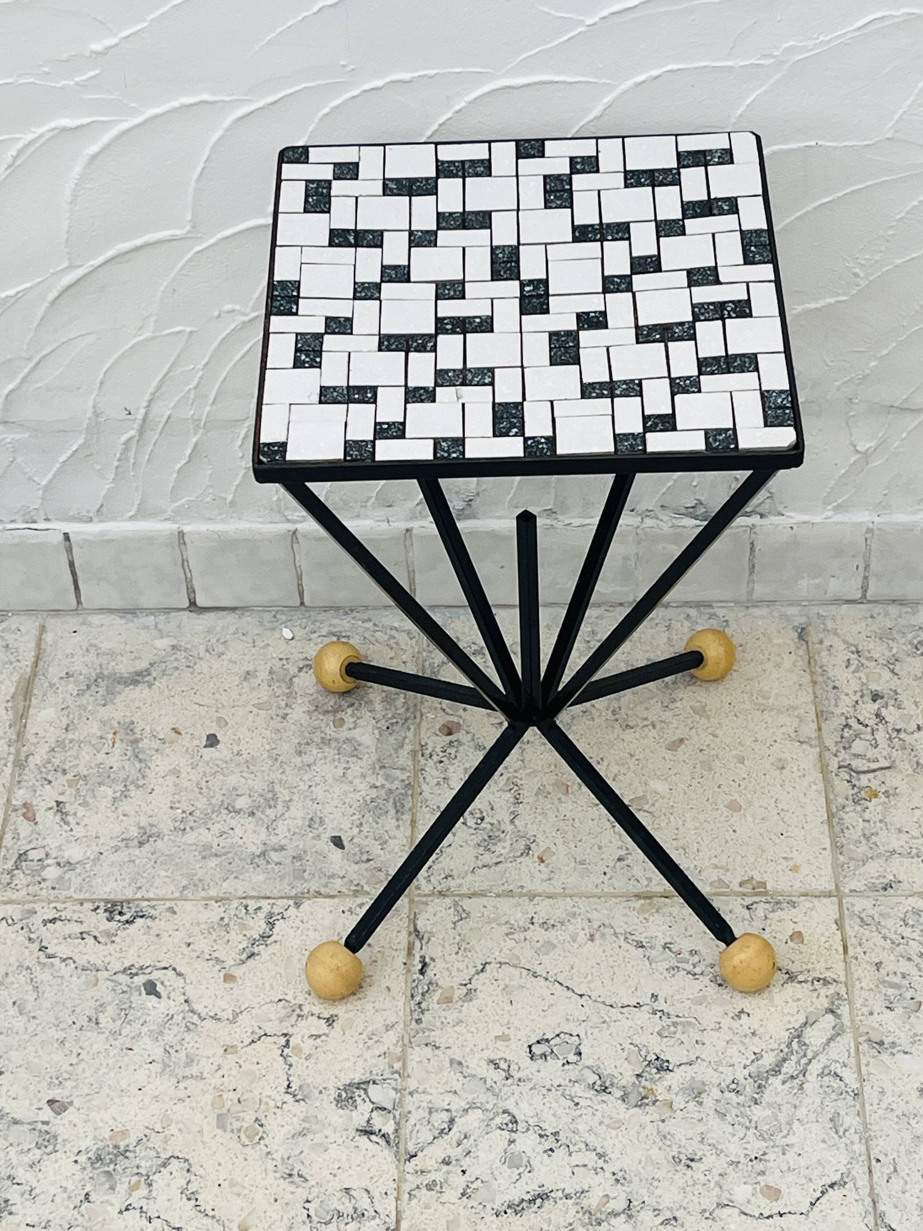Wrought iron stela and black and white tiled top from the 1960s.