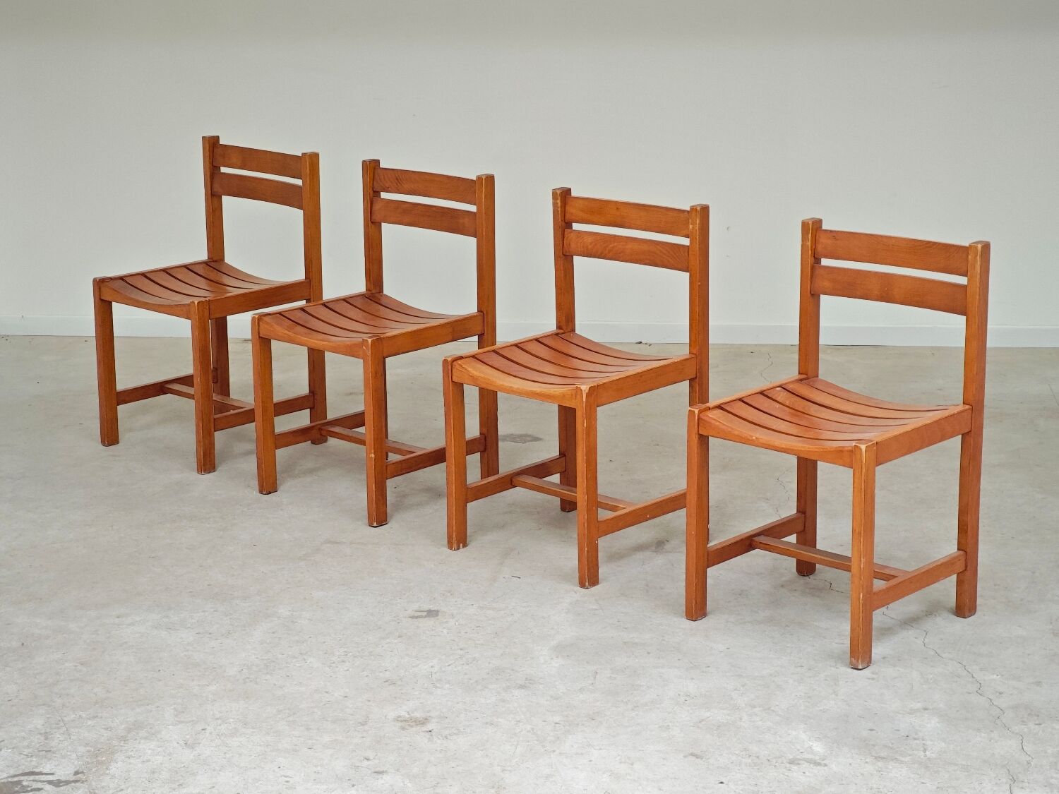 Set of 4 wooden chairs by André Sornay