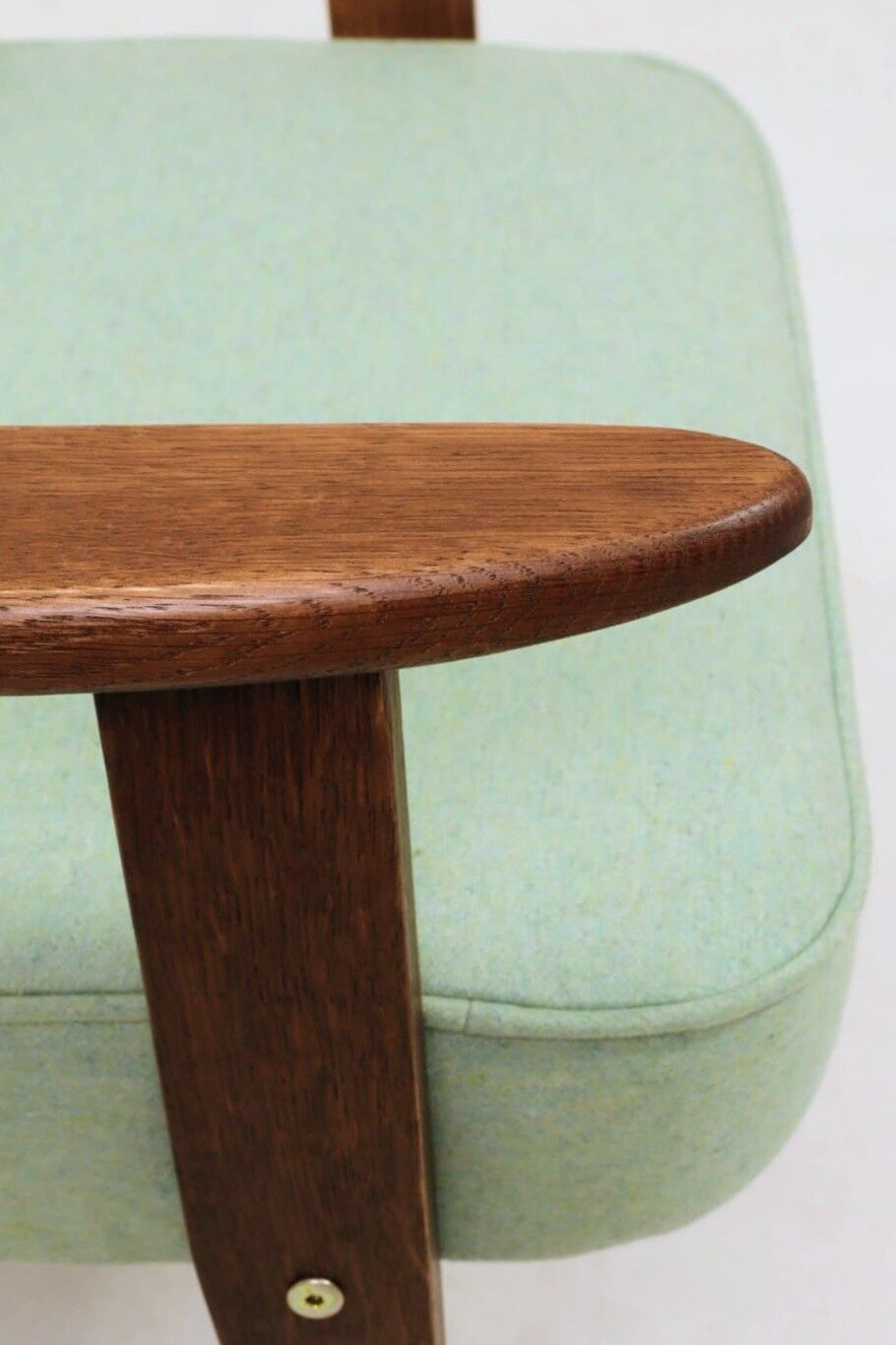 Pastel pistachio wool fabric Scandinavian armchair, oak wood.