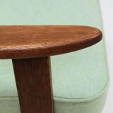 Pastel pistachio wool fabric Scandinavian armchair, oak wood.