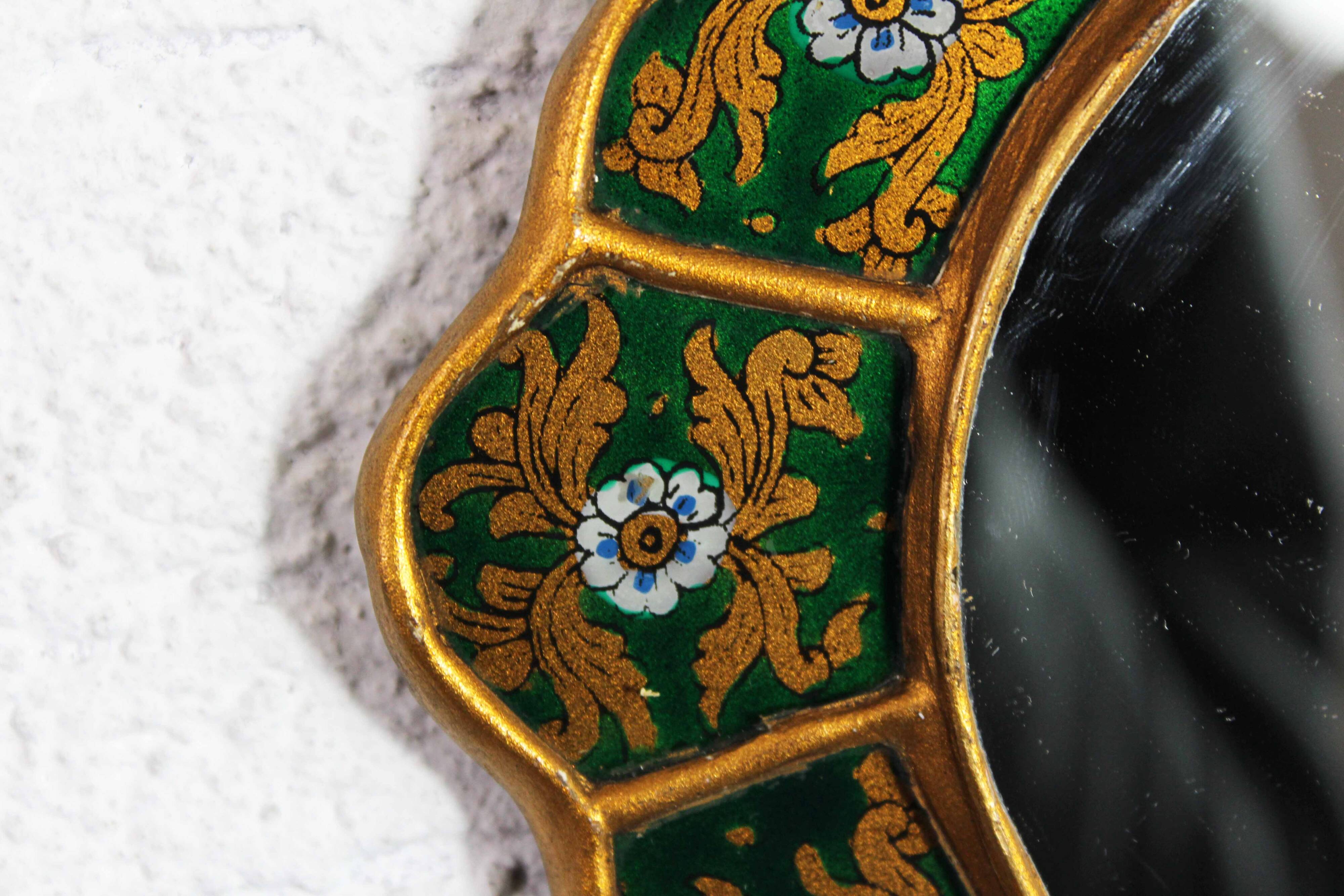 Golden mirror with decor