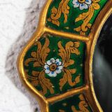 Golden mirror with decor