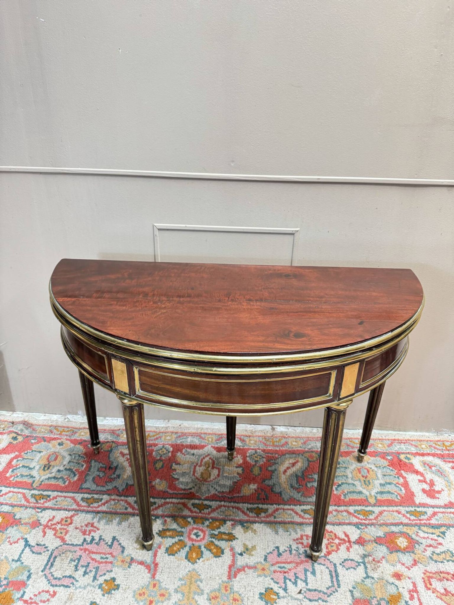 Half-moon table in mahogany from the Louis XVI period, 18th century.