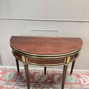 Half-moon table in mahogany from the Louis XVI period, 18th century.