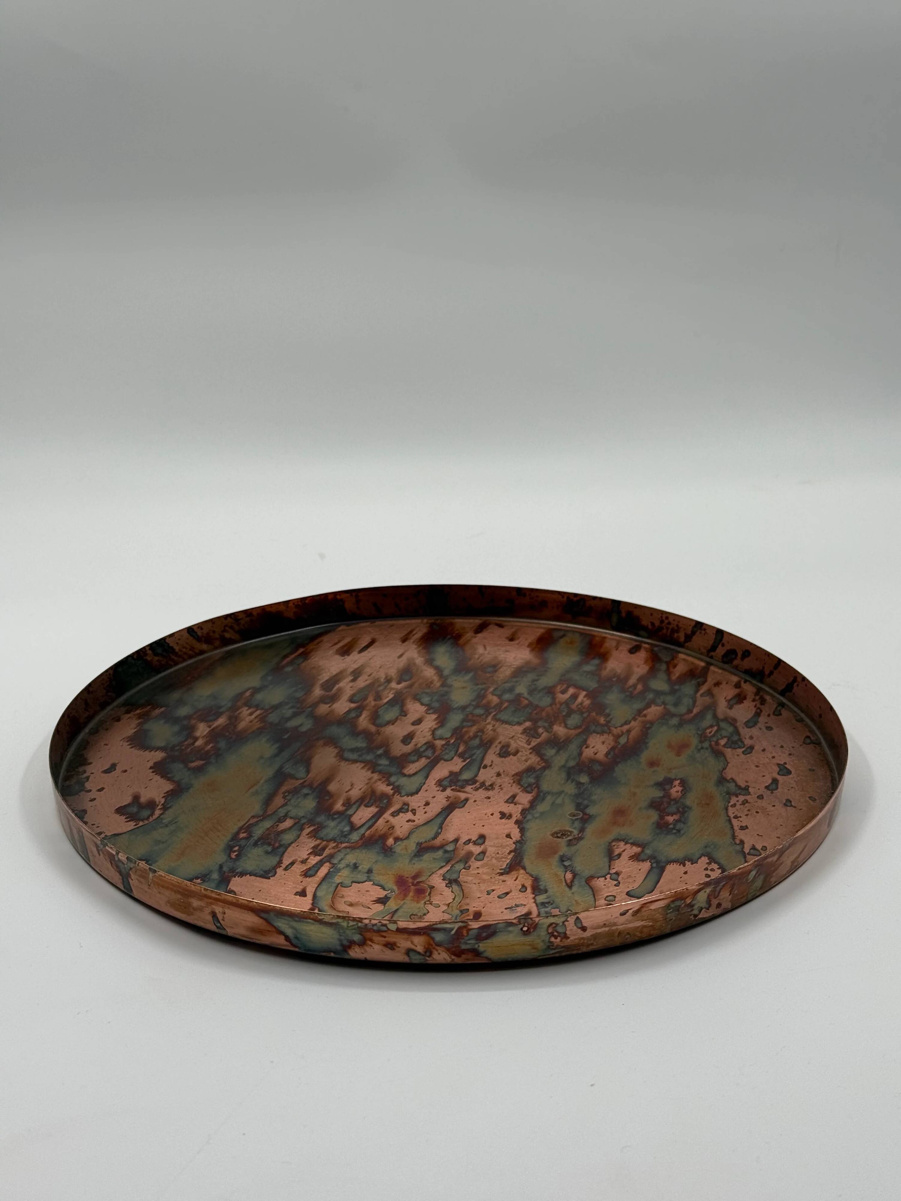 Round patinated copper platter, textured finish