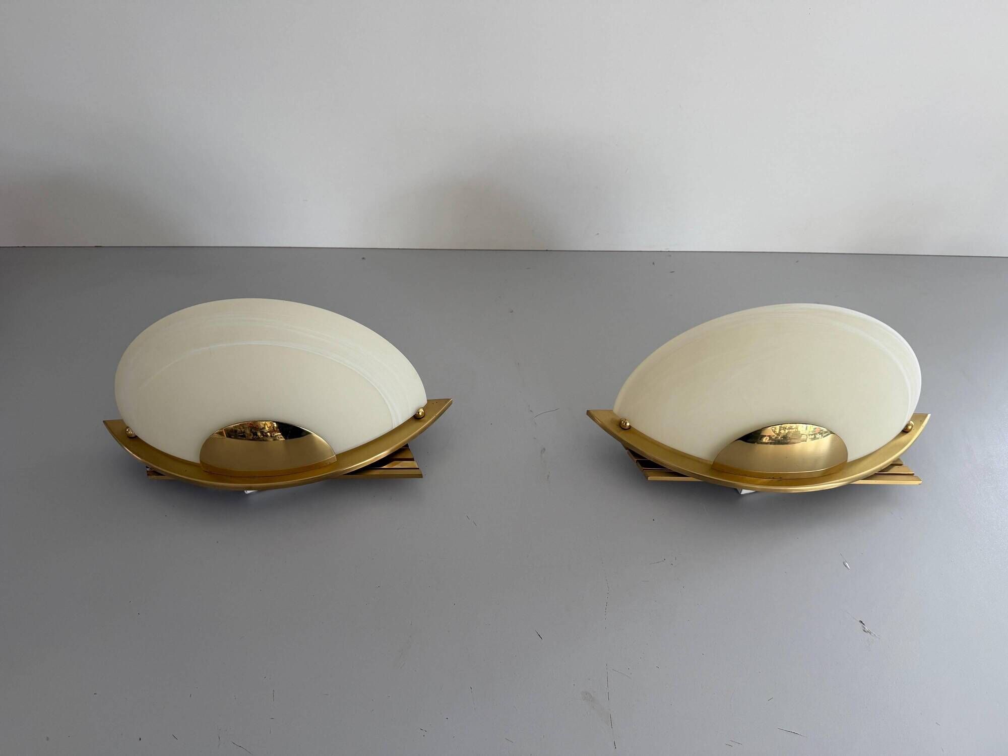 Pair of brass and glass wall lights from the Spage era, 1980, Germany.