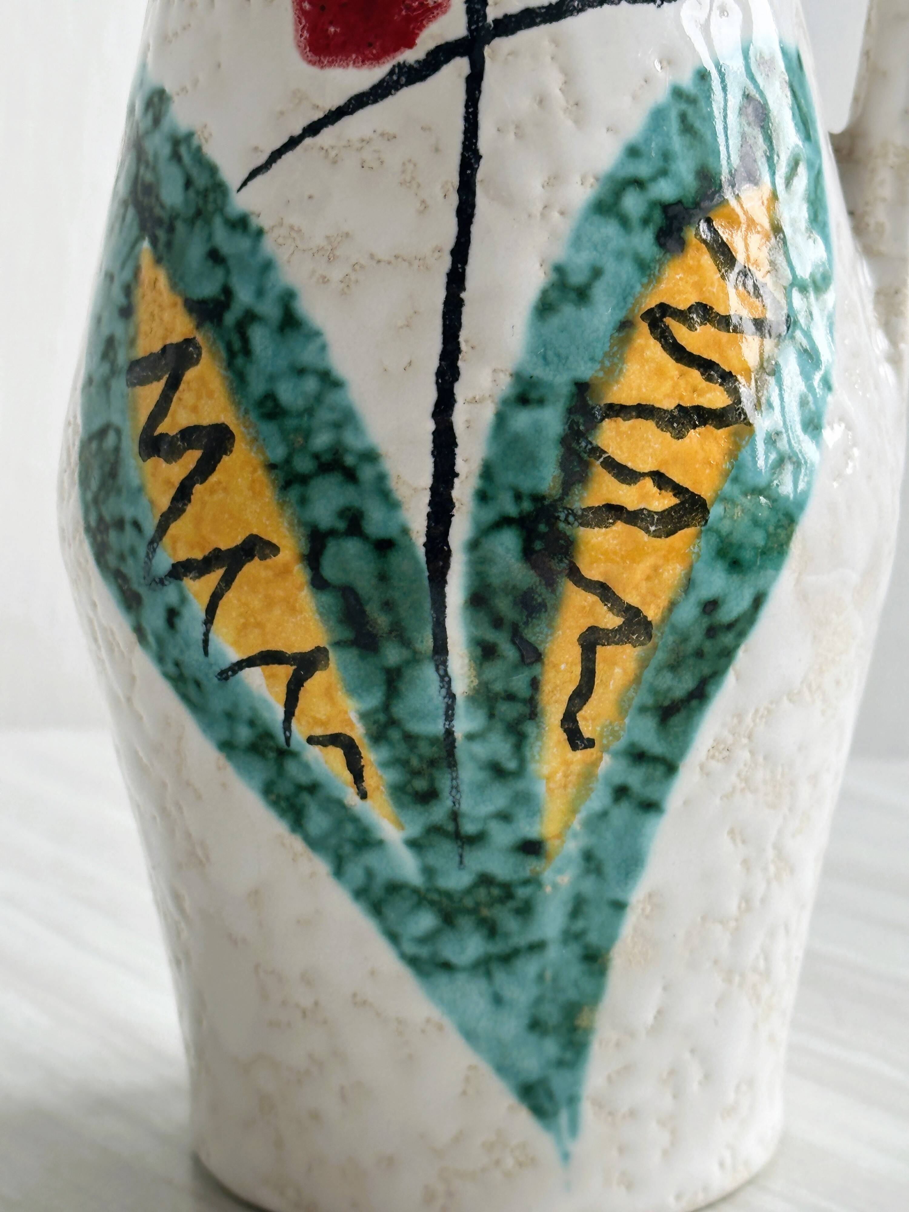Ceramic pitcher with hand painted floral pattern