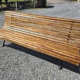 Wooden garden bench with cast iron base