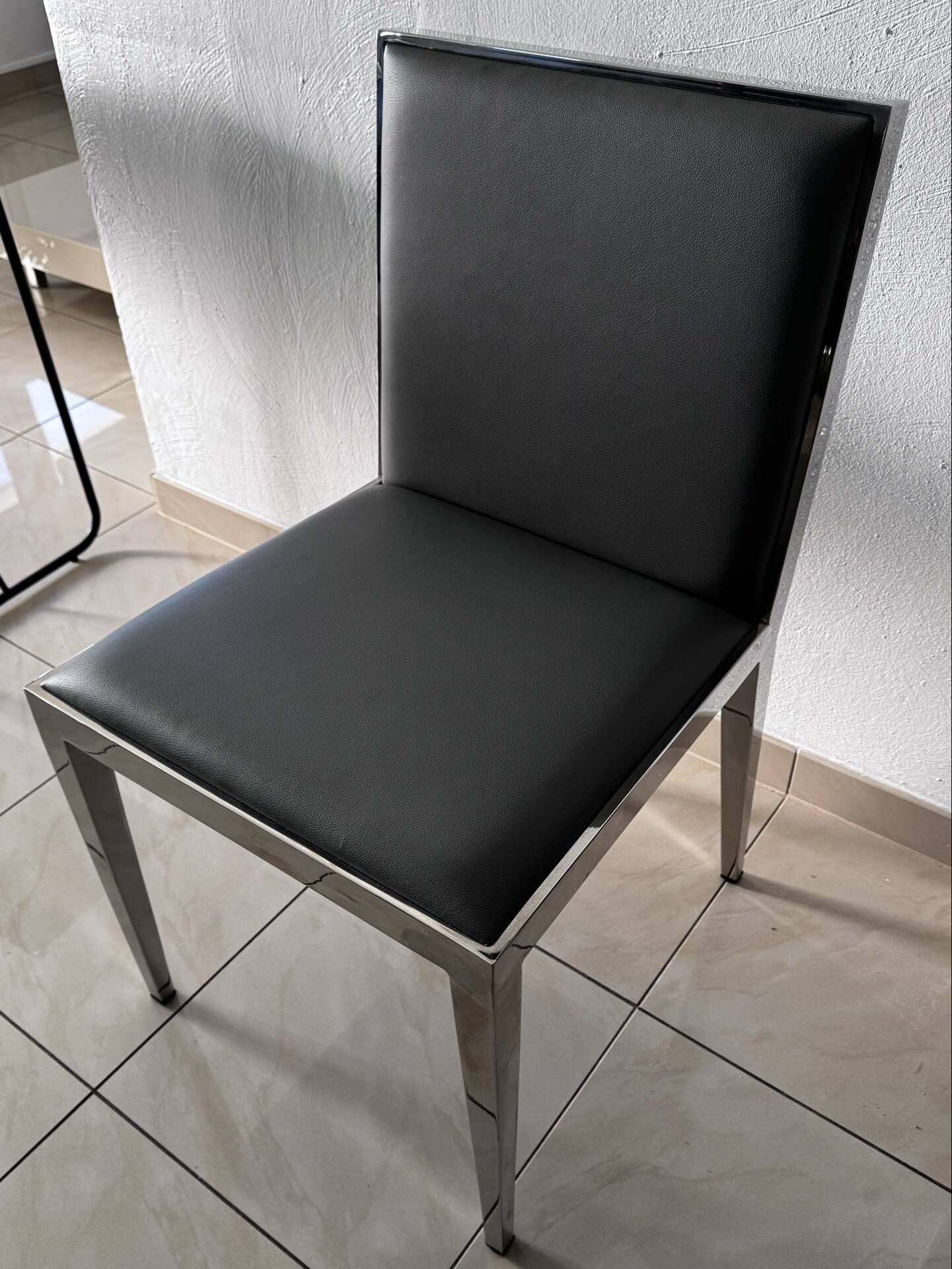 Lot of 4 leather chairs by baakal & ross