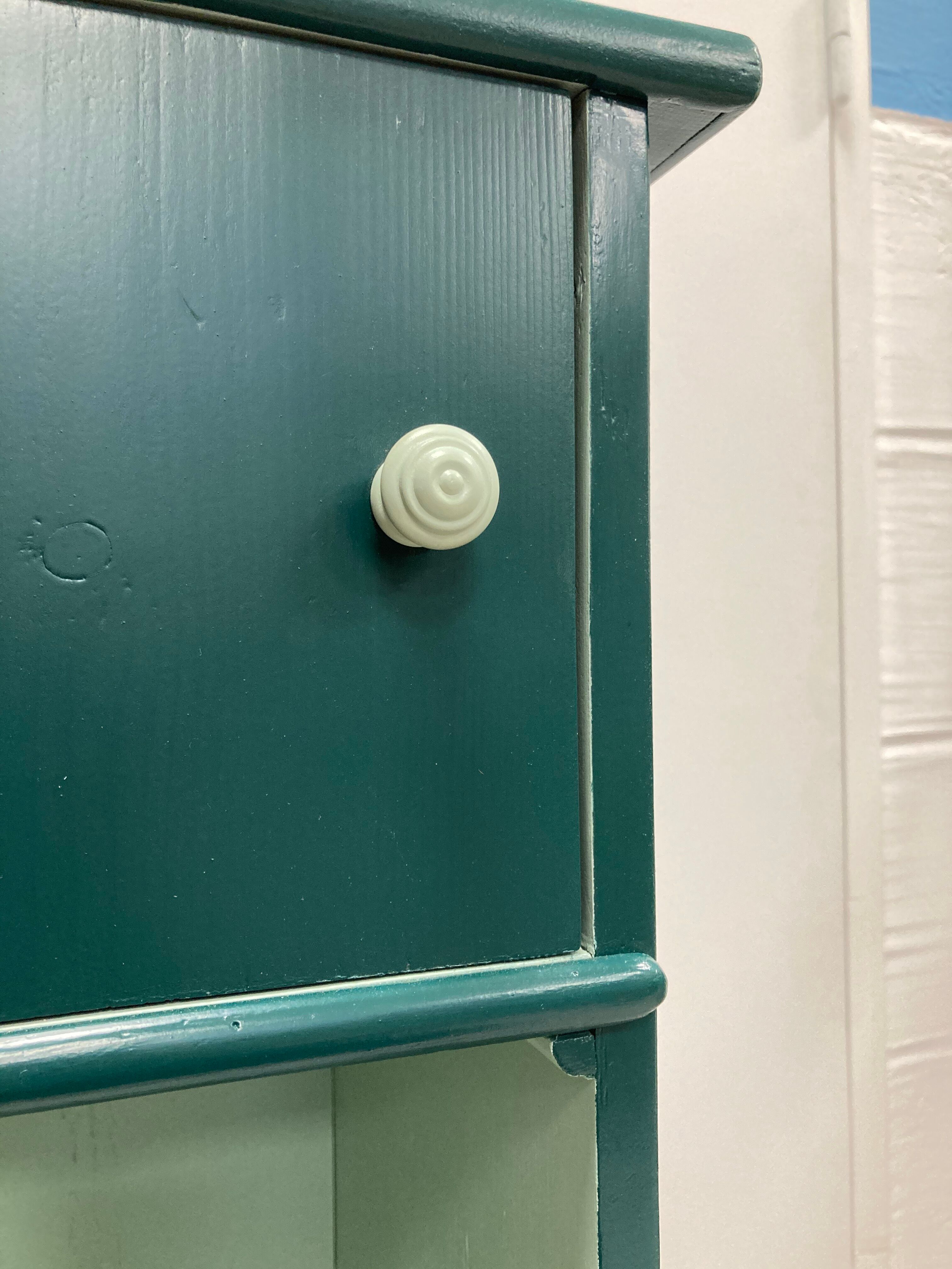 Two-door green bedside table