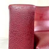 Vintage burgundy armchair, compass base in black metal and brass