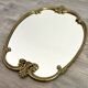 Vintage and rare gilt brass medallion/oblong/olave/rococo mirror