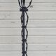 Black wrought iron floor lamp attributed to Gilbert Poillerat