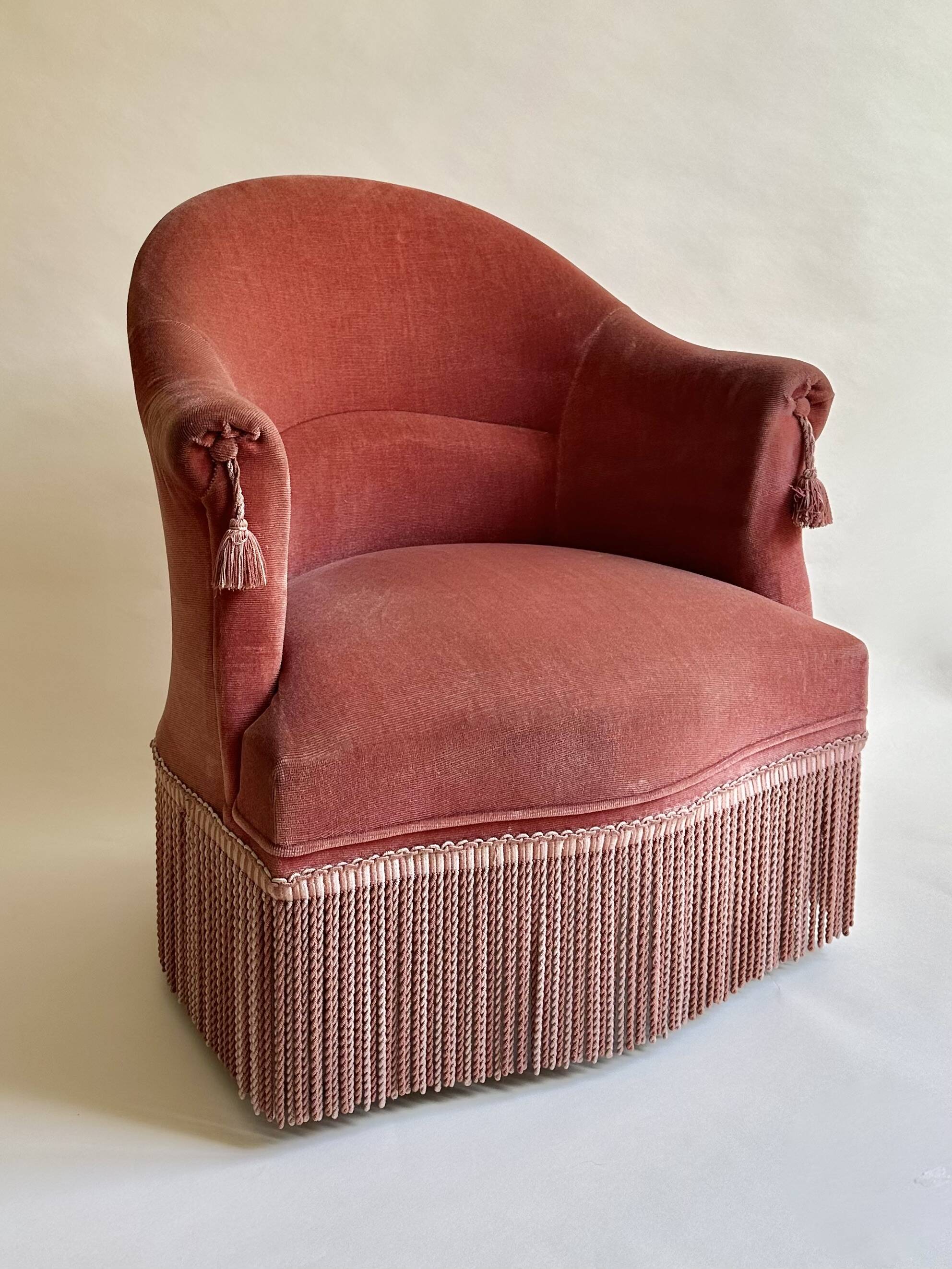 Pink-orange velvet tub chair