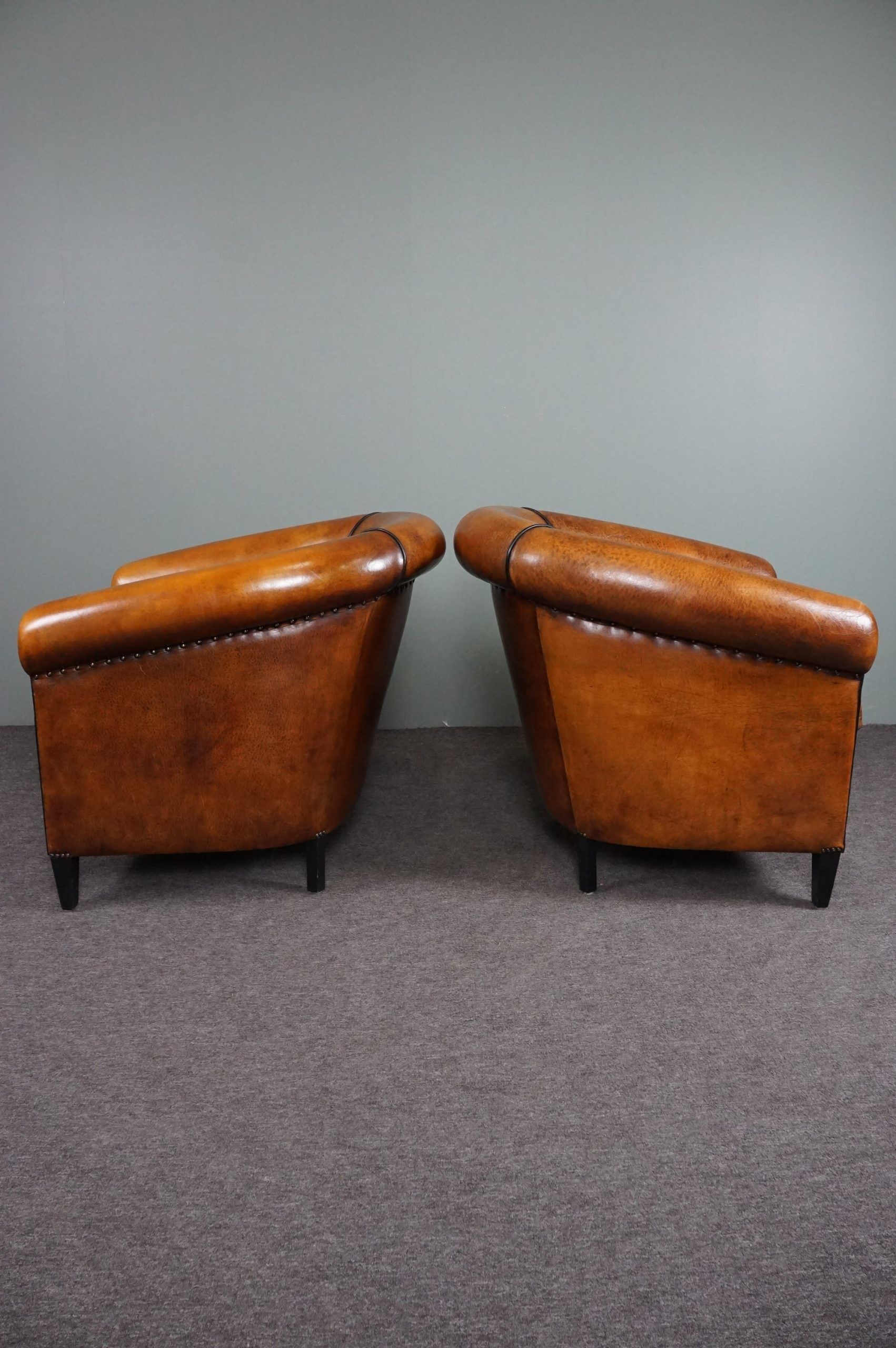 Set of 2 club chairs in black piping sheep leather