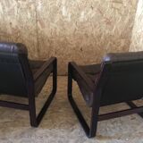 Pair of vintage armchairs in curved wood with suspended seat circa 1970-80.