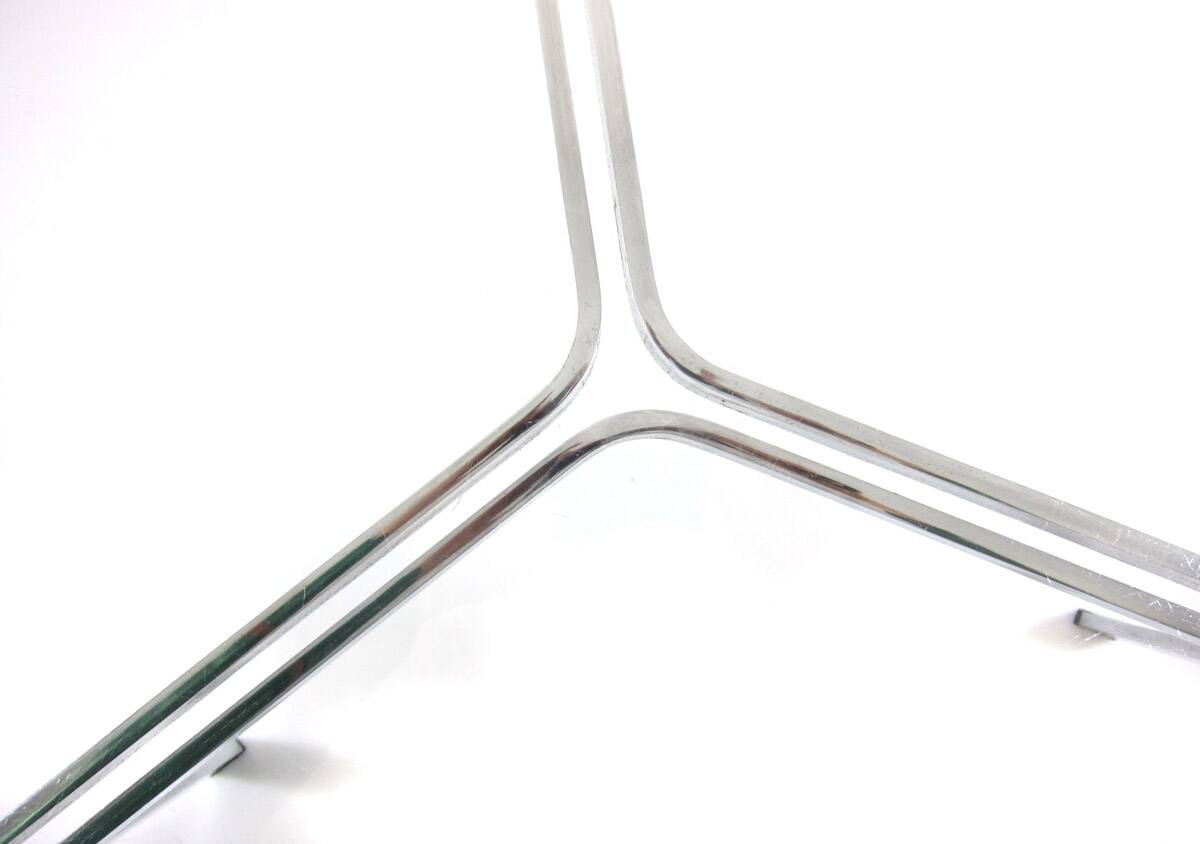 Modernist glass coffee table with stainless steel base