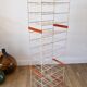 White and orange industrial shelf brand "caddie" 50s