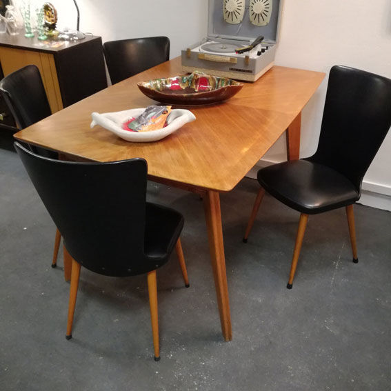 Dining table with compass feet